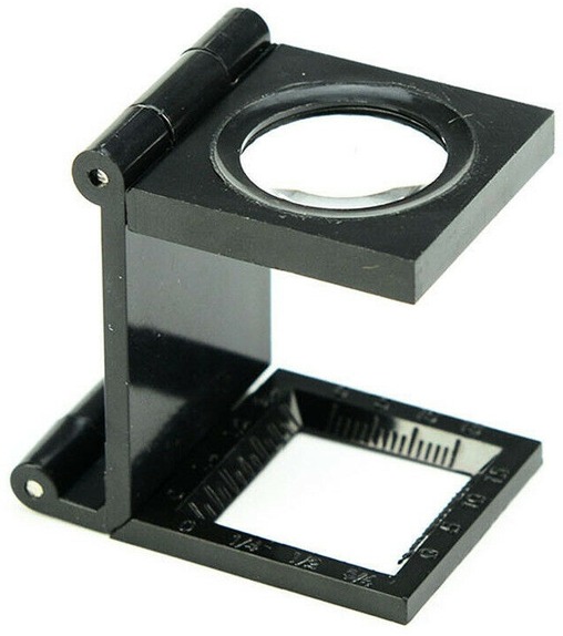 Folding magnifier (linen tester) for inspecting proDOC security features
